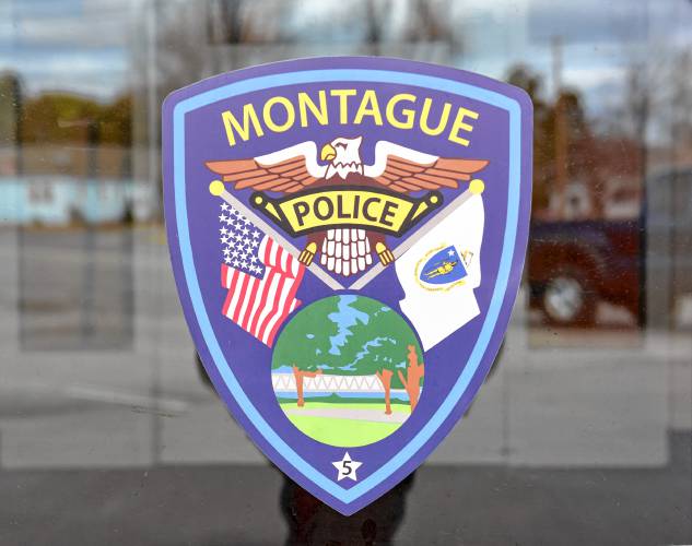 A Montague Police emblem on the Public Safety Complex door.