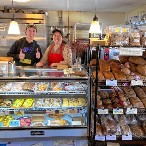 Sorrel Hatch, right, and another staff member welcome customers to the Little Red Hen Bakery at Upinngil’s farm store in Gill.