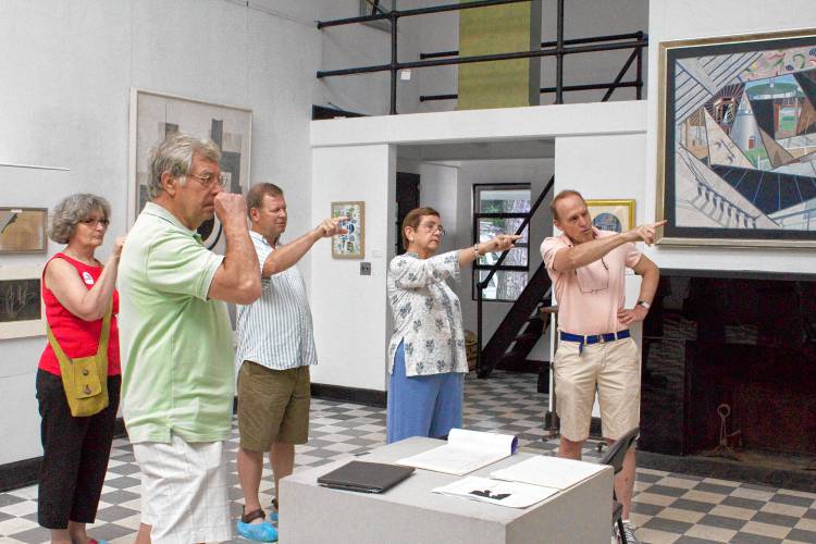 Suzy's nephew Kinney Frelinghuysen, right, makes a point regarding an artwork in the studio. Built in 1931, it's based upon a Parisian studio designed by the architect Le Corbusier.