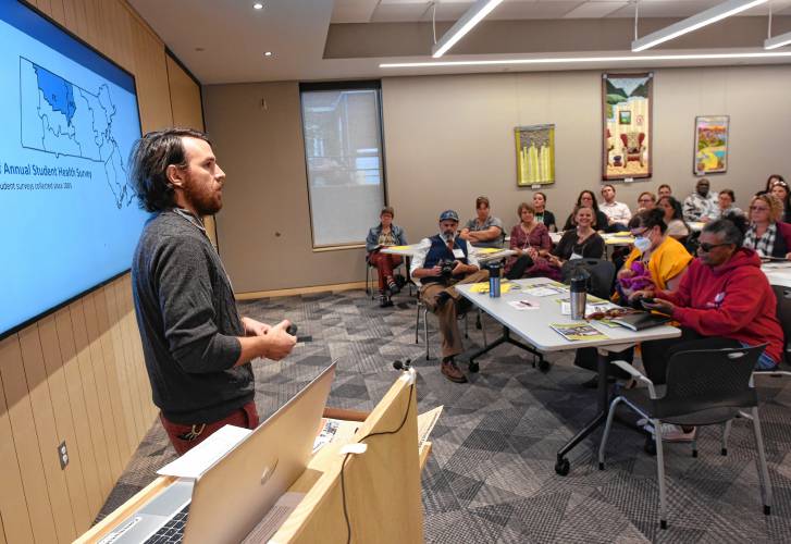 Nick Hathaway, evaluation coordinator for the Franklin Regional Council of Governments’ Partnership for Youth, talks about results of a student health survey at the Greenfield Public Library on Friday.