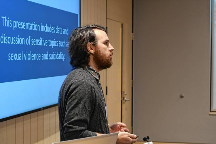 Nick Hathaway, evaluation coordinator for the Franklin Regional Council of Governments’ Partnership for Youth, talks about results of a student health survey at the Greenfield Public Library on Friday.