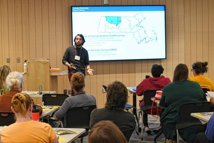 Nick Hathaway, evaluation coordinator for the Franklin Regional Council of Governments’ Partnership for Youth, talks about results of a student health survey at the Greenfield Public Library on Friday.