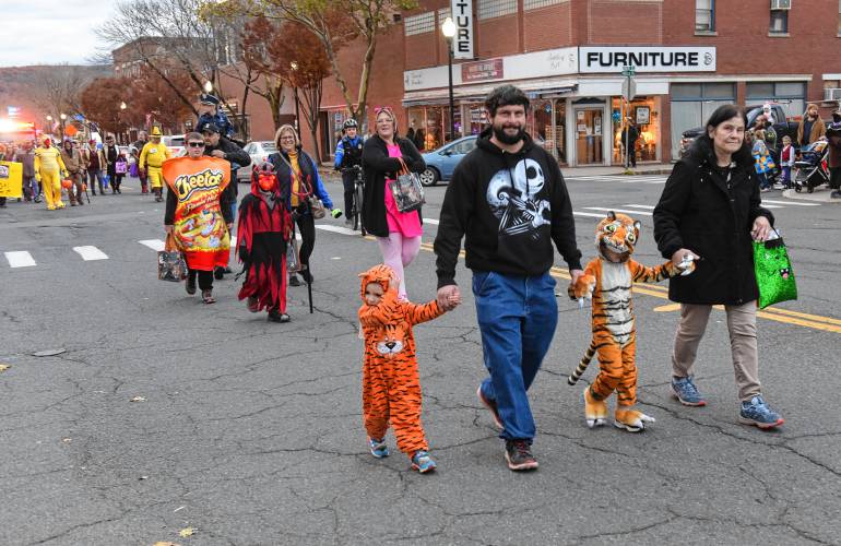 Characters walk in the rag shag parade on Halloween in Greenfield. 