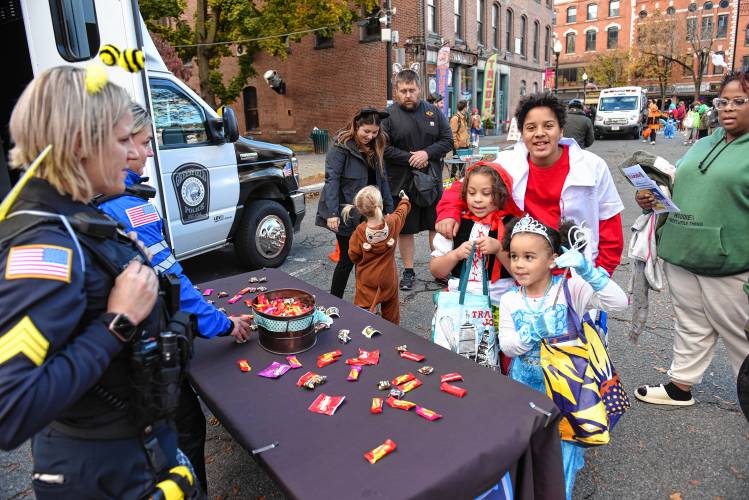 Police, fire and EMS personnel were on the Greenfield Common passing out candy.