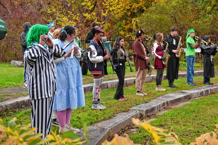 Members of the Greenfield High School Band, in costume, perform at Energy Park in Greenfield on Halloween.