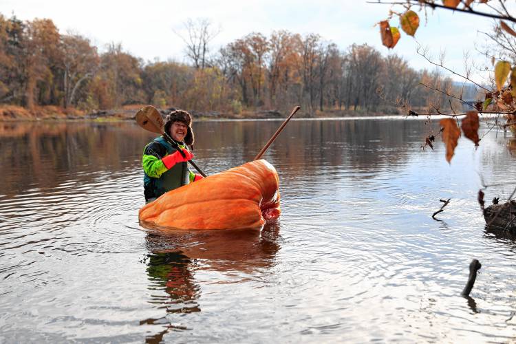 Florence resident Dave Rothstein starts his trek paddling a giant pumpkin down the Deerfield River on Saturday morning en route to the Connecticut River in a world record attempt.