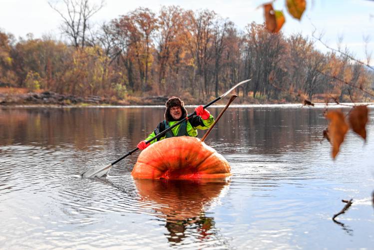 Florence resident Dave Rothstein starts his trek paddling a giant pumpkin down the Deerfield River on Saturday morning en route to the Connecticut River in a world record attempt.