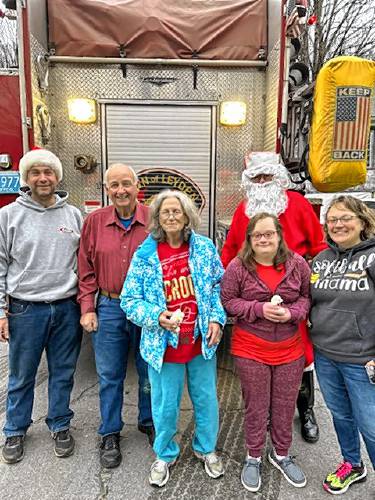 The Barton family, left to right, Carey, Elwin, Marylou, Tanya and Samantha, pictured with Santa.