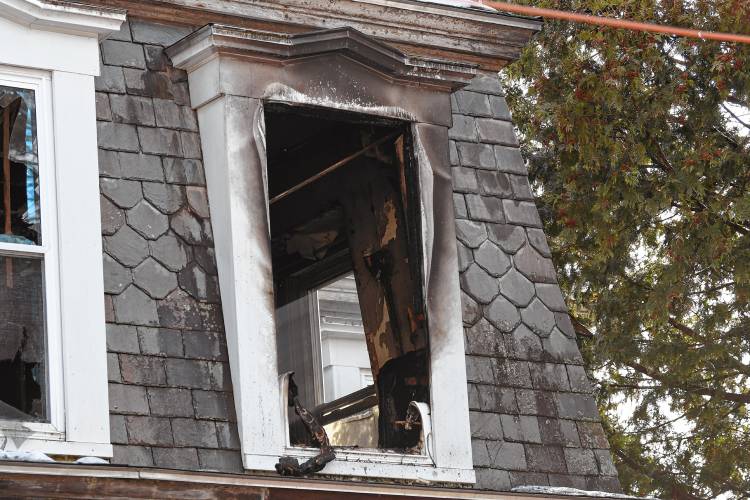 The second-floor window in a home at 86 Mechanic St. in Orange that caught fire on Wednesday.