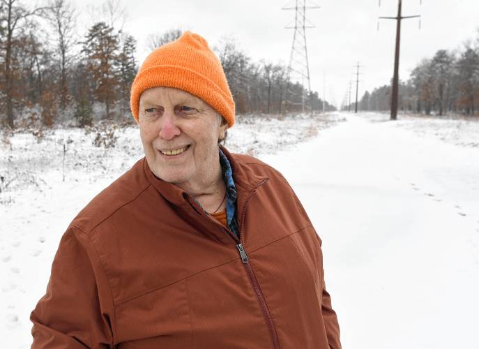 Sam Lovejoy stands on the Montague Plains near the spot where, 50 years ago, he toppled a weather tower being used to collect data for a proposed nuclear power plant. The crime and ensuing court case were chronicled in the one-hour documentary film “Lovejoy’s Nuclear War” the following year. The film will be shown at the Shea Theater Arts Center on Feb.22, the 50th anniversary of the event.