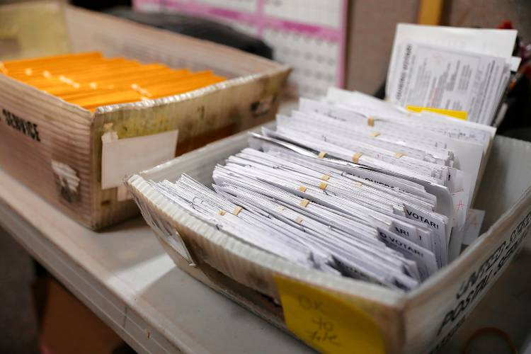 Mail-in ballots Friday afternoon at the Holyoke City Clerk’s Office.