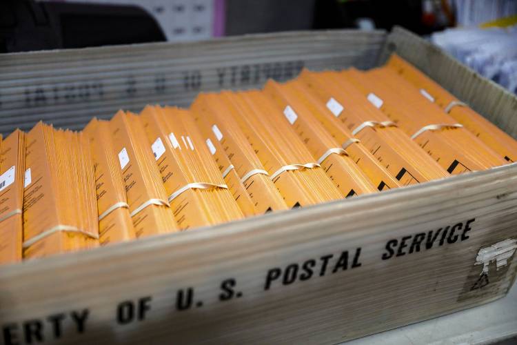 Mail-in ballots Friday afternoon at the Holyoke City Clerk’s Office.