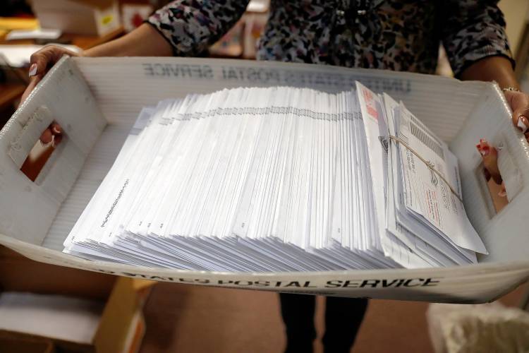 Mail-in ballots Friday afternoon at the Holyoke City Clerk’s Office.