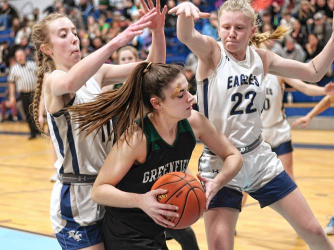 Franklin Tech’s Lea Chapman, left, and Kaitlin Trudeau (22) defend Greenfield’s Amber Bergeron during the host Eagles’  PVIAC Class C quarterfinal round victory in Turners Falls on Monday night. 