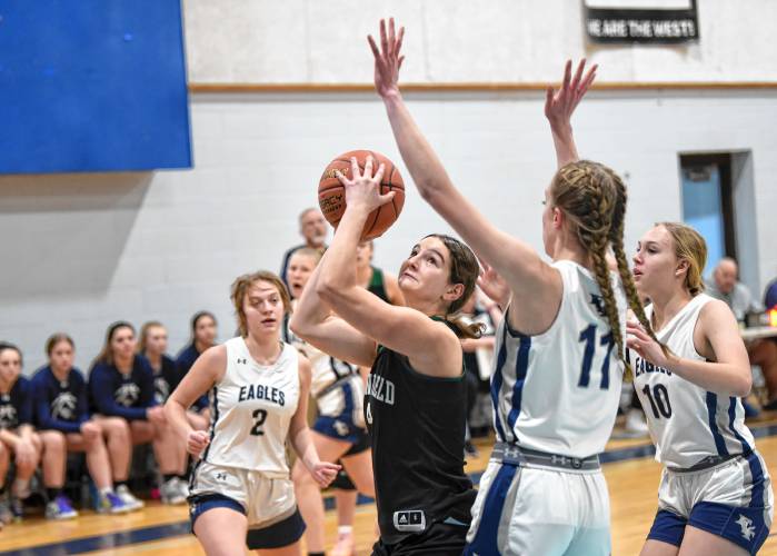 Greenfield’s Carly Blanchard goes to the basket while defended by Franklin Tech’s Lea Chapman (11) during the host Eagles’  PVIAC Class C quarterfinal round victory in Turners Falls on Monday night. 