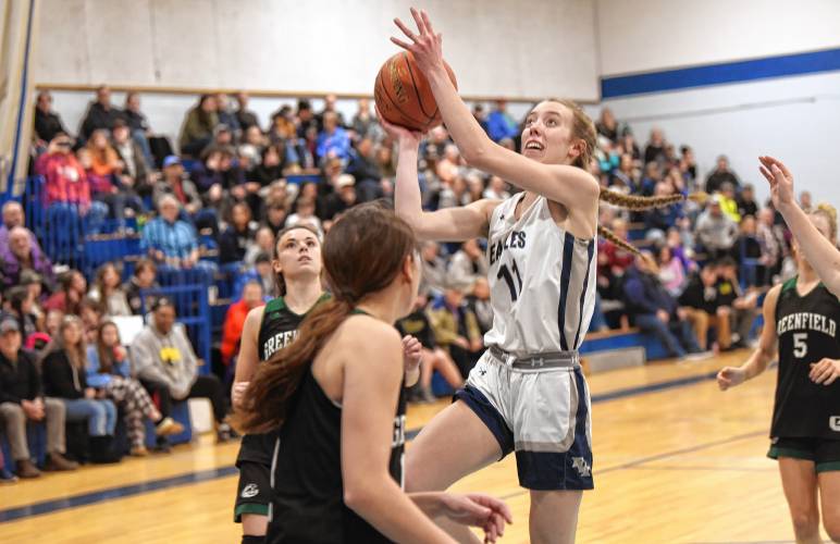 Franklins Tech’s Lea Chapman (11) goes to the basket against Greenfield during the host Eagles’  PVIAC Class C quarterfinal round victory in Turners Falls on Monday night. 