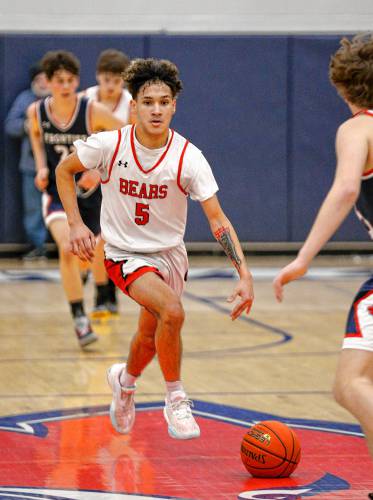 Athol’s Angel Castillo (5) dribbles down the court against Frontier earlier this season at Goodnow Gymnasium in South Deerfield. Castillo helped the Bears knock off Ware in the Western Mass. Class C quarterfinals on Monday. 