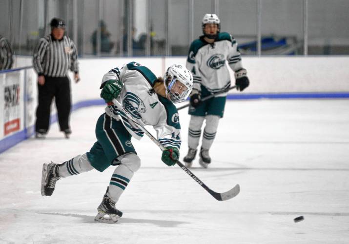 Greenfield’s Matt Garvin (14) fires a shot against Easthampton in the second period Saturday night at Collins-Moylan Arena in Greenfield.