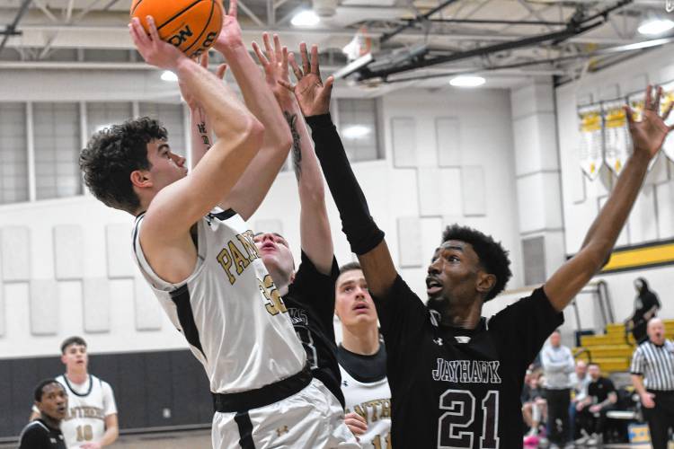 Pioneer’s Josh Wood is defended by Duggan’s Caleb Murphy in first half action of a Western Mass. Class D semifinal contest at Messer Gymnasium in Northfield Wednesday. 