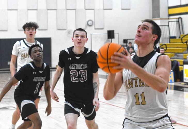 Pioneer’s Hugh Cyhowski goes up for a shot against  Duggan during the first half of a Western Mass. Class D semifinal contest at Messer Gymnasium in Northfield Wednesday. 