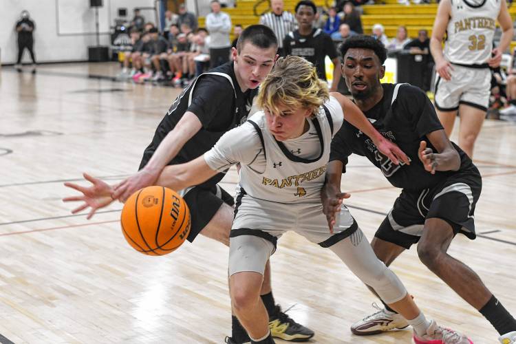 Pioneer’s Jackson Glazier goes after a loose ball vs Duggan in first half action of a Western Mass. Class D semifinal contest at Messer Gymnasium in Northfield Wednesday. 