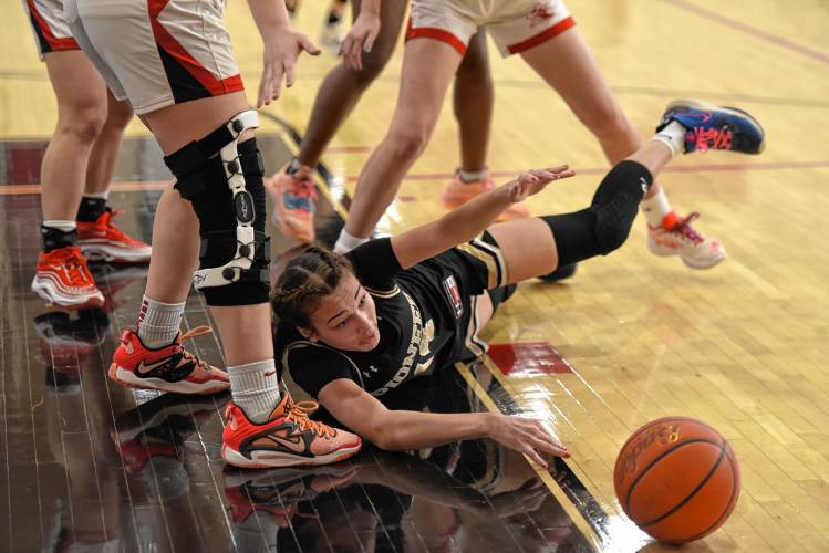 Pioneer’s Natalie Rios dives for a loose ball against Hoosac Valley during the Panthers’ 57-35 loss in the Western Mass. Class D championship game on Saturday at Westfield High School.