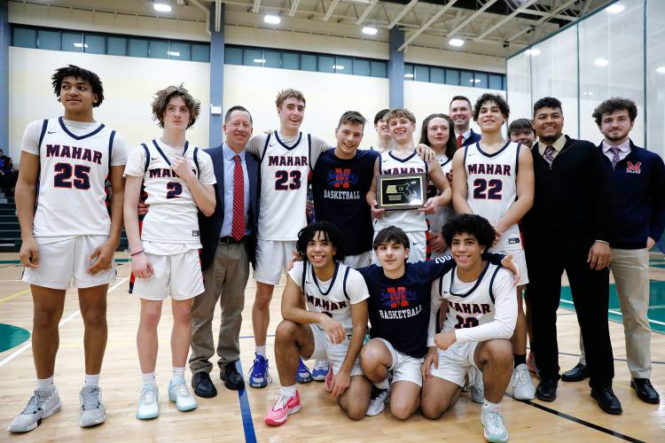 Mahar poses for a team photo after winning the Western Mass. Class C boys basketball championship Saturday against Granby at Holyoke Community College.