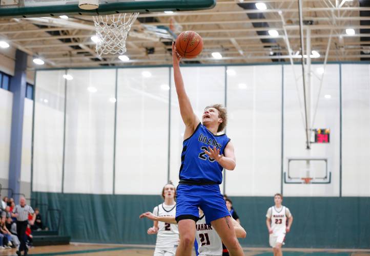 Granby’s Cody White (23) goes up for a breakaway layup against Mahar in the third quarter of the Western Mass. Class C boys basketball championship Saturday at Holyoke Community College.