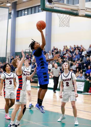 Granby’s Gavier Fernandez (5) puts in a layup against Mahar in the fourth quarter of the Western Mass. Class C boys basketball championship Saturday at Holyoke Community College.