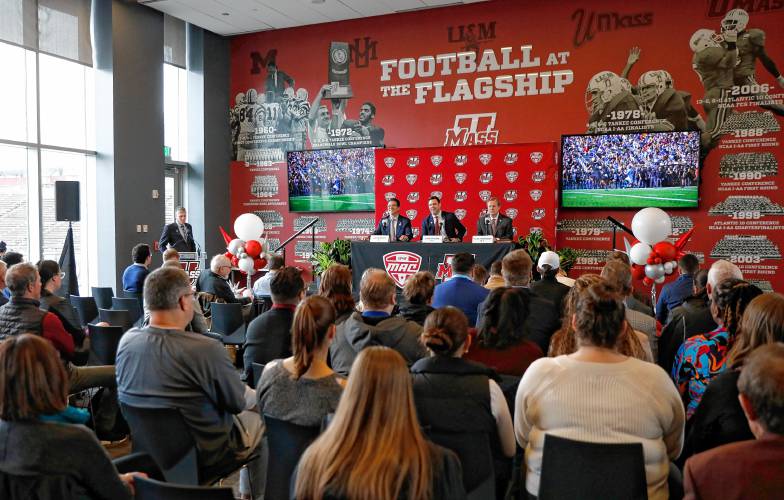 Chancellor Javier Reyes, from left, Director of Athletlics Ryan Bamford and MAC commissioner Dr. Jon Steinbrecher speak during a press conference at the Martin Jacobson Football Performance Center on Thursday regarding the University of Massachusetts joining the Mid-American Conference.