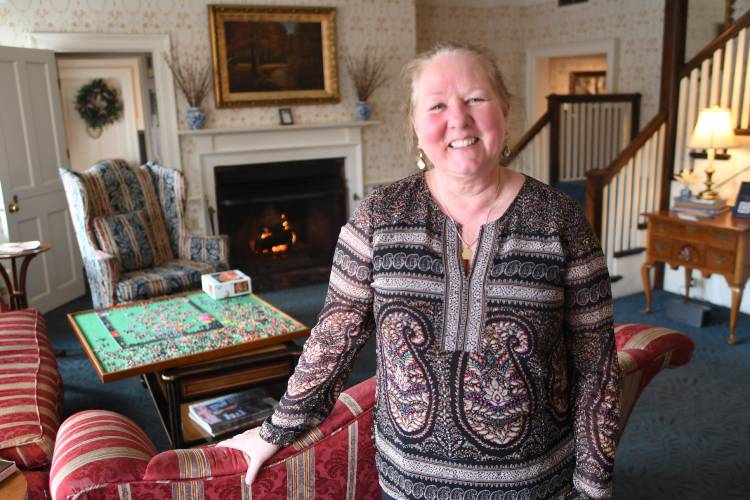 Innkeeper Laurie McDonald, pictured inside the Deerfield Inn in Old Deerfield, says the number of rooms available in the area could easily increase. “There is so much demand coming out this way,” she says. “I could have 500 rooms and they would still sell out in May.”