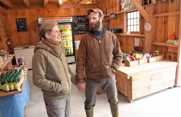 Co-owners Maggie Toran and David Fisher in their farm store at Natural Roots farm in Conway.