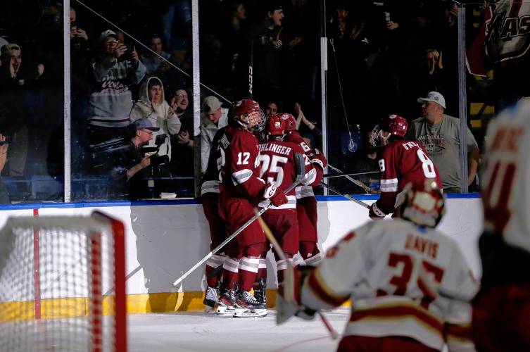 UMass players and fans celebrate after a goal by Liam Gorman (20) against Denver in the second period of the opening round of the NCAA tournament Friday at the MassMutual Center in Springfield.