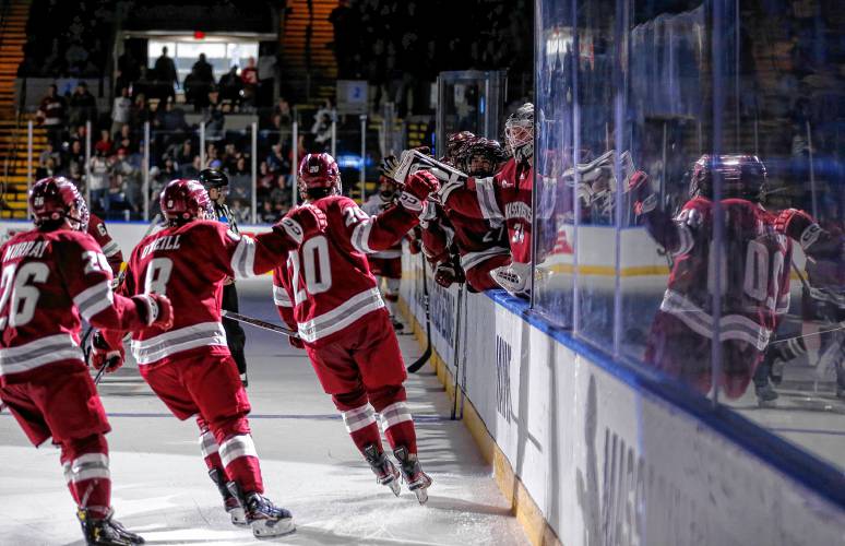 UMass players celebrate after a goal by Liam Gorman (20) against Denver in the second period of the opening round of the NCAA tournament Friday at the MassMutual Center in Springfield.