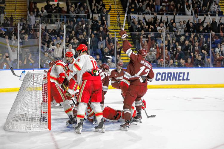 UMass players and fans celebrate after a goal by Liam Gorman (20) against Denver in the second period of the opening round of the NCAA tournament Friday at the MassMutual Center in Springfield.