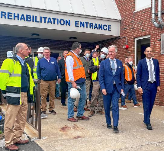 U.S. Rep. Richard Neal, center, tours the construction site of the new Veterans’ Home in Holyoke, joined by Massachusetts Veterans’ Services Secretary Jon Santiago, right.