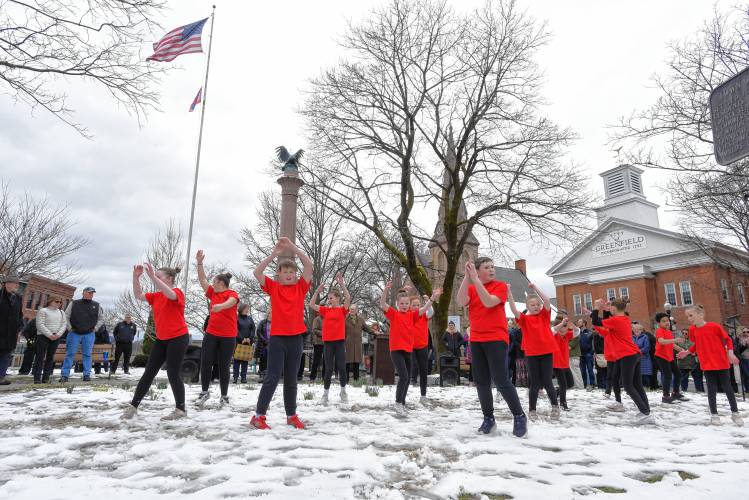 Members of the Ja’Duke Center for the Performing Arts dance on the Greenfield Common during a flag-raising ceremony for Child Abuse Prevention Month on Friday morning.