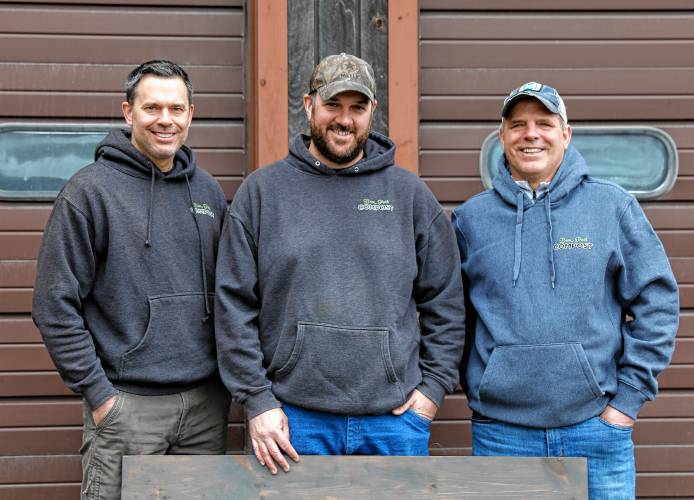 Bear Path Compost owners Mark Melnik, from left, Mike Mahar and Peter Melnik on Saturday morning in Whately.