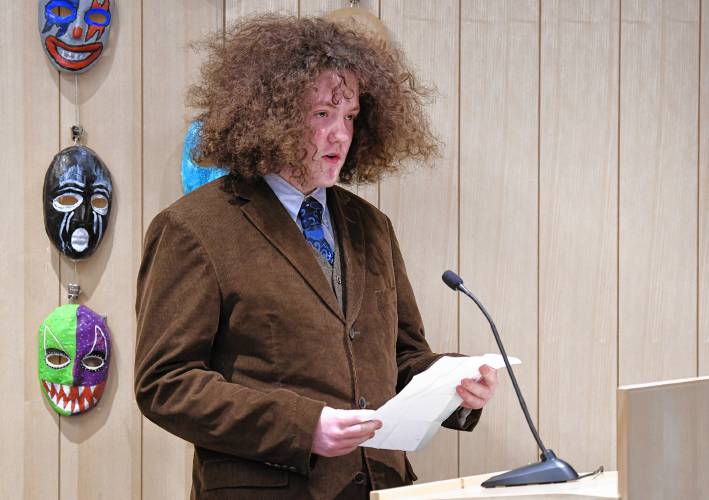 Henry Maxey, a finalist in the category for ages 15 to 18, reads his poem “The Smith Tower” at the Poet’s Seat Poetry Contest awards ceremony at the Greenfield Public Library on Tuesday evening. 