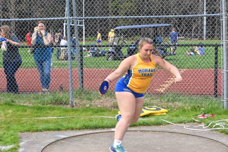 Mohawk Trail’s Cammie Thompson competes in the discus during a meet against Frontier on Monday in Buckland. 