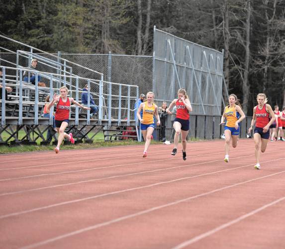 Frontier and Mohawk Trail athletes compete in the 100 during a meet in Buckland on Monday. 