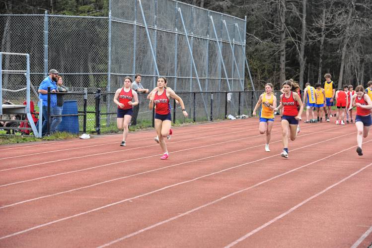 Athletes from Frontier and Mohawk Trail compete in the 100 during a meet in Buckland on Monday. 