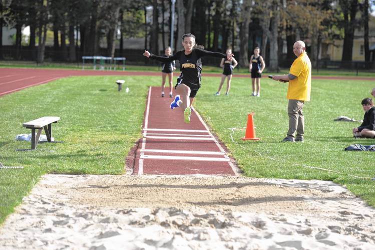 Pioneer’s Sahana Heilman competes in the triple jump during a meet in Greenfield on Wednesday. 