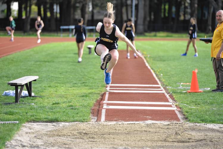 Pioneer’s Emmanuelle Flagollet competes in the triple jump during a meet in Greenfield on Wednesday. 