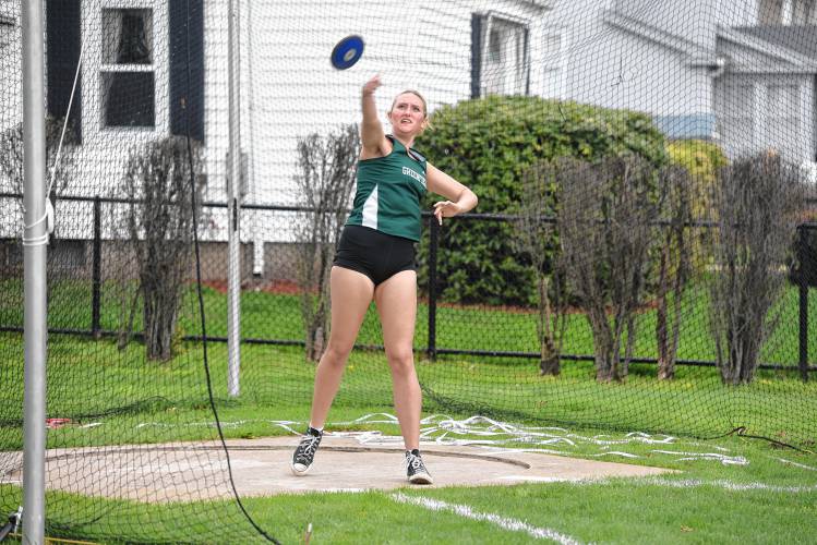 Greenfield’s Layla Prescott competes in the discus during a meet in Greenfield on Wednesday. 