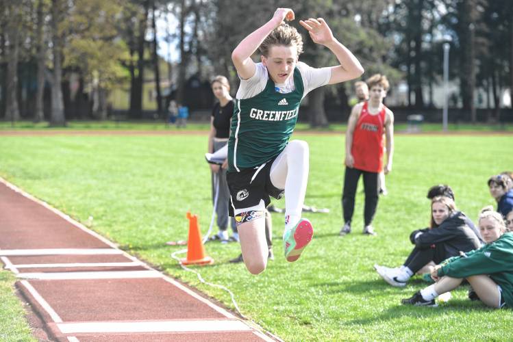 Greenfield’s Grayson Thomas competes in the triple jump during a meet in Greenfield on Wednesday. 