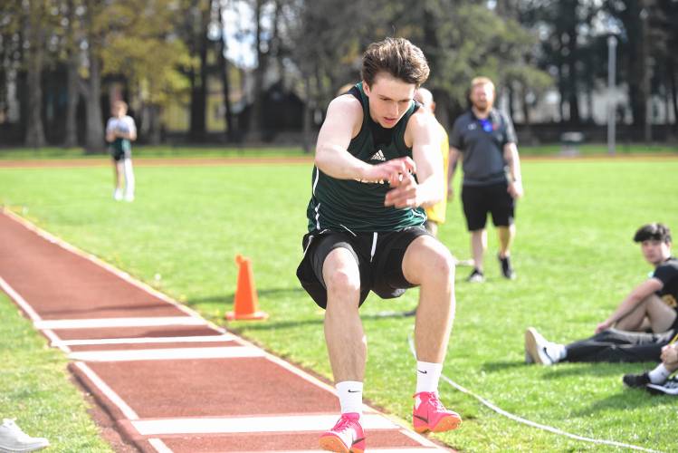 Greenfield’s Jacob Blanchard competes in the triple jump during a meet in Greenfield on Wednesday. 