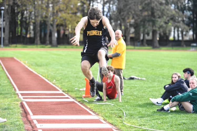 Pioneer’s Griffin de Ruiter competes in the triple jump during a meet in Greenfield on Wednesday. 