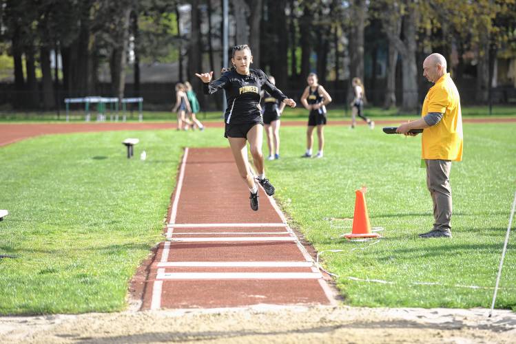 Pioneer’s Lauryn Kalinowski competes in the triple jump during a meet in Greenfield on Wednesday. 