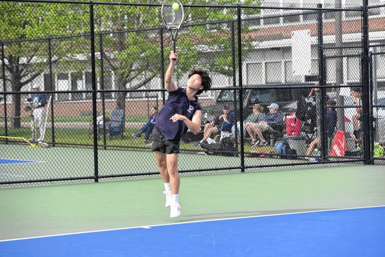 Frontier’s Jacob Han serves in No. 1 singles against Pope Francis on Monday in South Deerfield. 